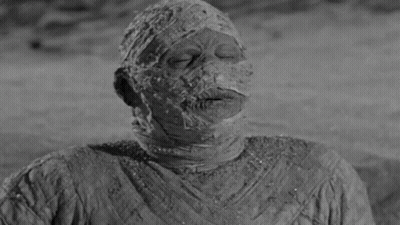 Black And White Mummy With Cigarette Mouth Open GIF