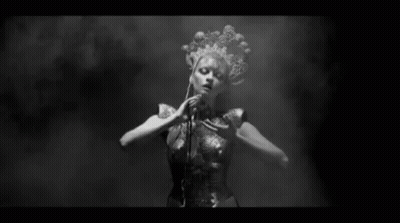Black and White Naked Woman Dancing in Dark Room