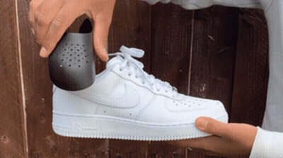 Black And White Nike Shoe With Blue Swoosh GIF