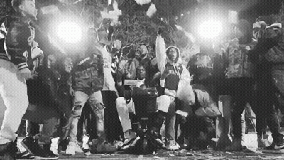 Black And White People Around Man With Money Bag GIF