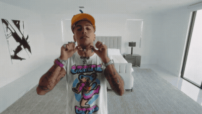 Black And White Person Holding Blue Object GIF