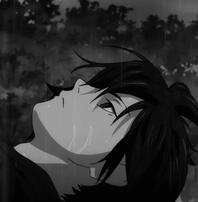 Black And White Person Laying In Rain GIF