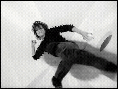 Black And White Person Laying On Ground GIF