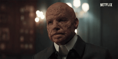 Black And White Person's Face In The Dark GIF