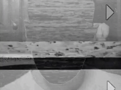 Black And White Person's Face On Screen GIF