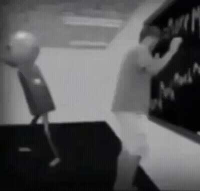 Black And White Person Writing On Blackboard GIF