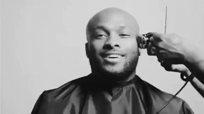 Black And White Photo Man Getting Haircut GIF