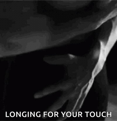 Black And White Photo Man Touching Woman's Chest GIF