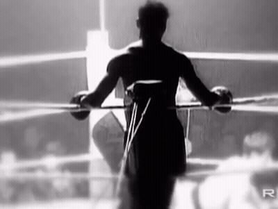 Black And White Photo Of Boxer In Boxing Ring GIF