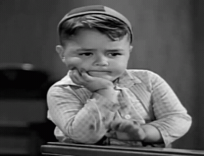 Black And White Photo Of Boy With Hand On Face GIF