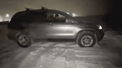 Black And White Photo Of Car Driving In Snow GIF