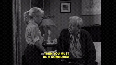 Black And White Photo Of Elderly Man And Little Girl Saying Then You Must Be A Communist GIF