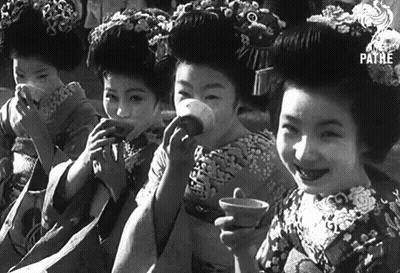 Black And White Photo Of Geishas Drinking Tea GIF