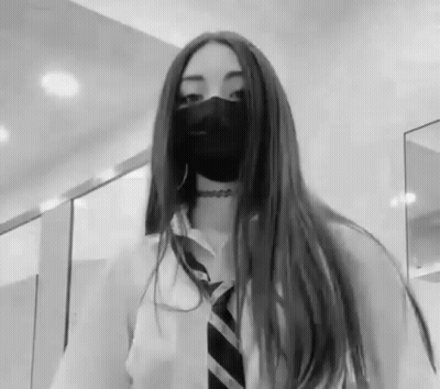 Black And White Photo Of Girl Wearing Mask GIF