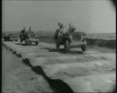 Black And White Photo Of Group Of Jeeps GIF
