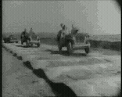 Black And White Photo Of Jeep Drivers Driving Down Road GIF
