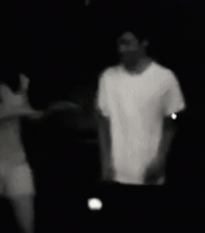 Black And White Photo Of Man And Woman Holding Hands GIF