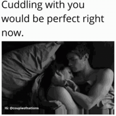 Black And White Photo Of Man And Woman Hugging In Bed GIF