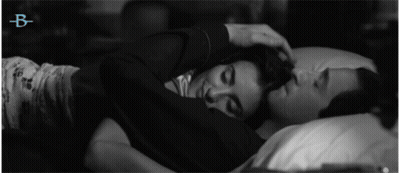 Black And White Photo Of Man And Woman Hugging With Letter B GIF