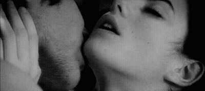 Black And White Photo Of Man And Woman Kissing GIF