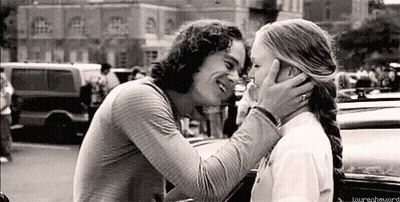 Black And White Photo Of Man And Woman Kissing GIF