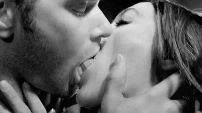 Black And White Photo Of Man And Woman Kissing GIF
