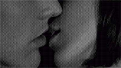 Black And White Photo Of Man And Woman Kissing GIF