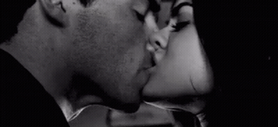 Black And White Photo Of Man And Woman Kissing GIF