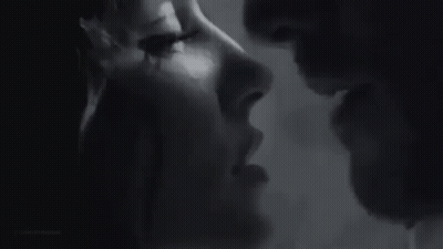 Black and White Photo of Man and Woman Kissing