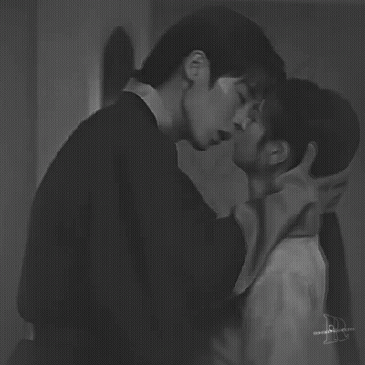 Black And White Photo Of Man And Woman Kissing GIF