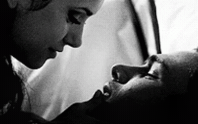 Black And White Photo Of Man And Woman Kissing GIF