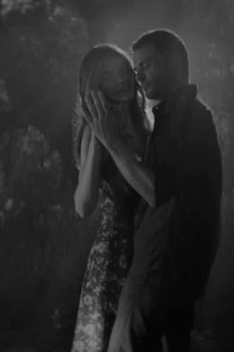 Black And White Photo Of Man And Woman Saying I Never Stopped Loving You GIF
