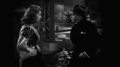 Black and White Photo of Man and Woman Talking