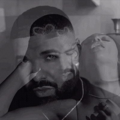 Black And White Photo Of Man And Woman With Drake On His Head GIF