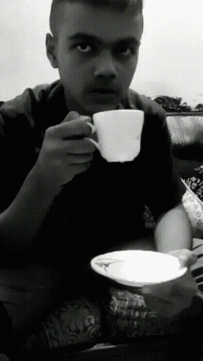 Black And White Photo Of Man Drinking From Cup GIF