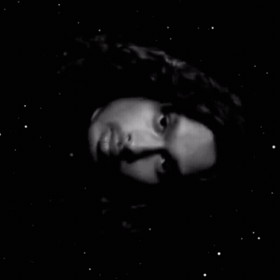 Black And White Photo Of Man Face In Hole GIF