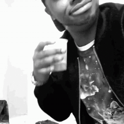 Black And White Photo Of Man Holding Coffee GIF