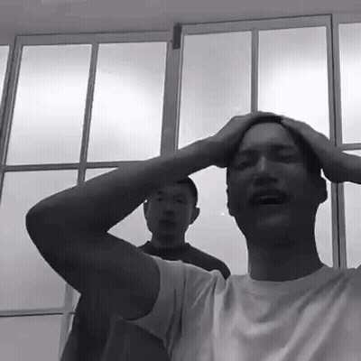 Black And White Photo Of Man Holding Head GIF