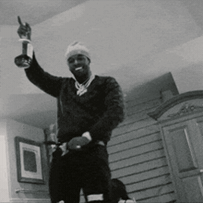 Black And White Photo Of Man Holding Trophy GIF