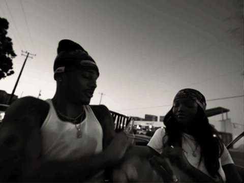 Black And White Photo Of Man In Beanie And Woman In Bandana GIF