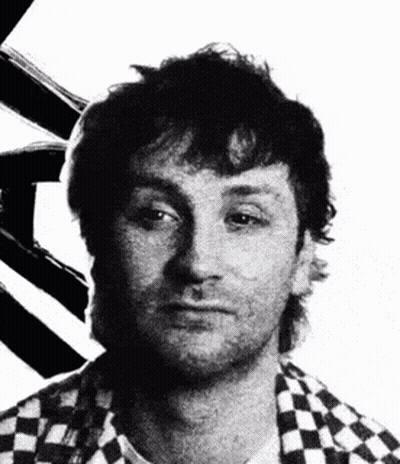 Black And White Photo Of Man In Checkered Shirt GIF