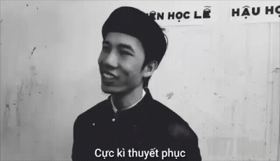 Black And White Photo Of Man In Front Of Cục Kỳ Thuyết Phục Sign GIF