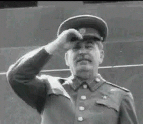 Black And White Photo Of Man In Military Uniform Waving GIF