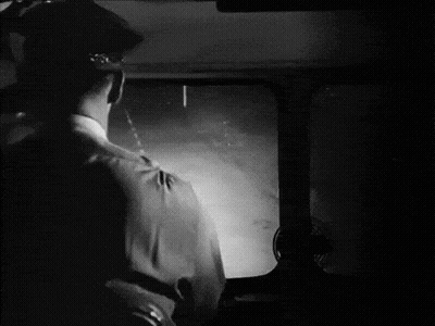 Black And White Photo Of Man Looking Out Window GIF