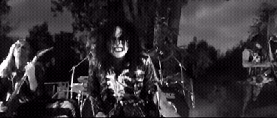 Black And White Photo Of Man Playing Drum Set Saying Rock GIF