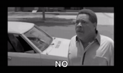 Black And White Photo Of Man Saying No In Front Of Car GIF