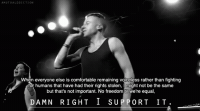 Black And White Photo Of Man Singing Into Microphone GIF