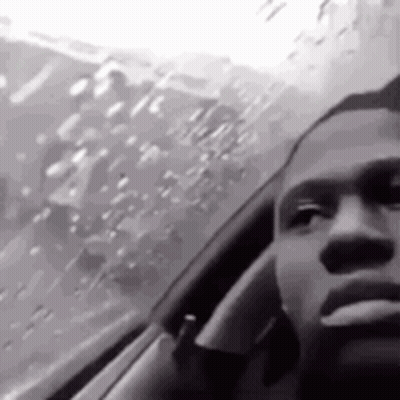 Black And White Photo Of Man Sitting In Car GIF