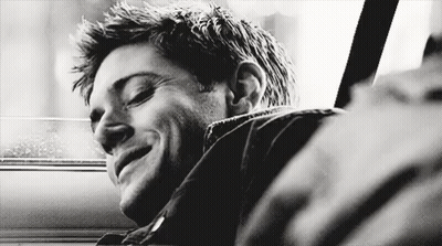 Black And White Photo Of Man Smiling In Car GIF