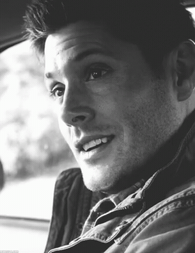 Black And White Photo Of Man Smiling In Car GIF